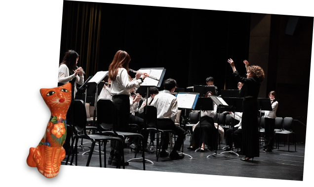 Merrie conducting students